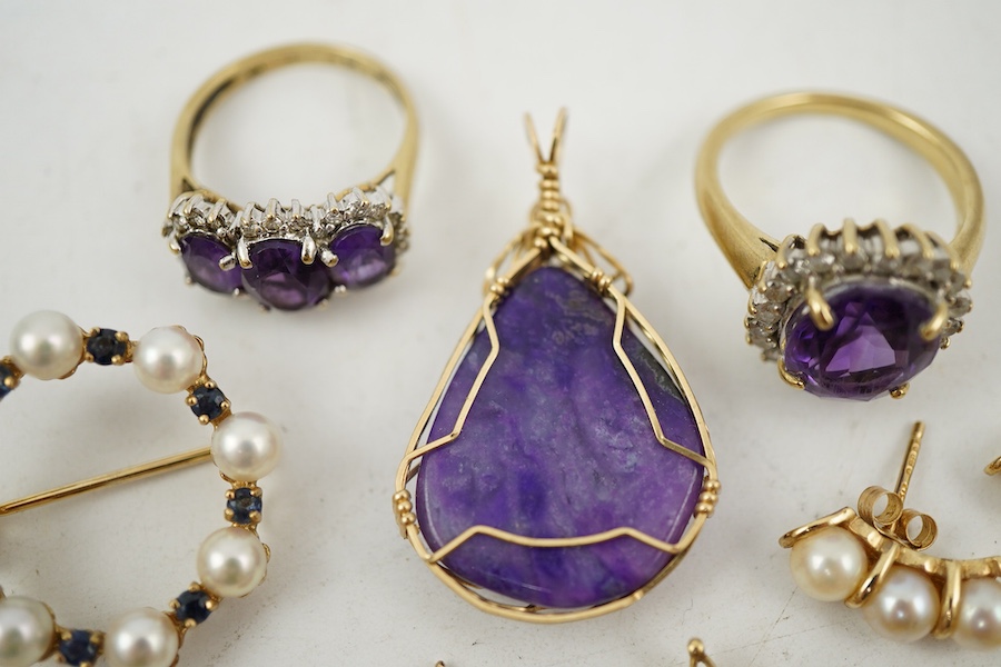 A collection of jewels, comprising: two amethyst and diamond rings; a cultured pearl and circular-cut sapphire wreath brooch; a fire opal pendant, one stone deficient; and a pair of cultured pearl earrings, all mounted i